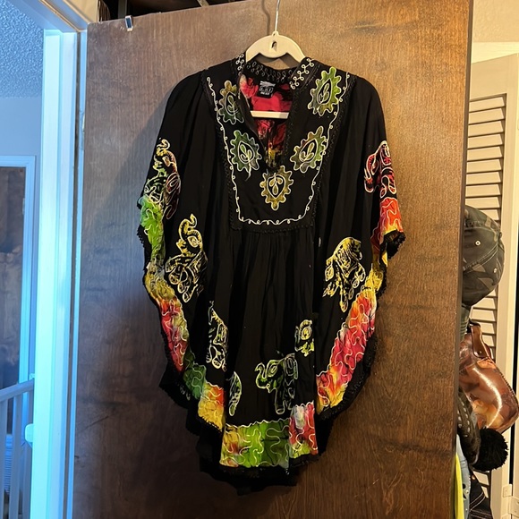 A black top with elephants, and then embroidery around the elephant and neckline - Picture 4 of 5